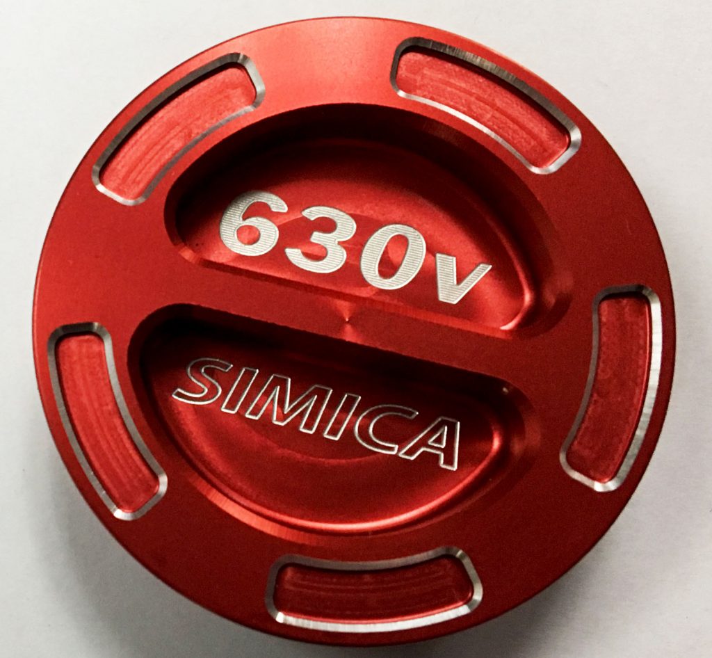 A red anodized aluminum part with precision CNC engraving